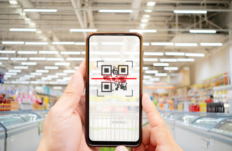 holding phone supermarket qr